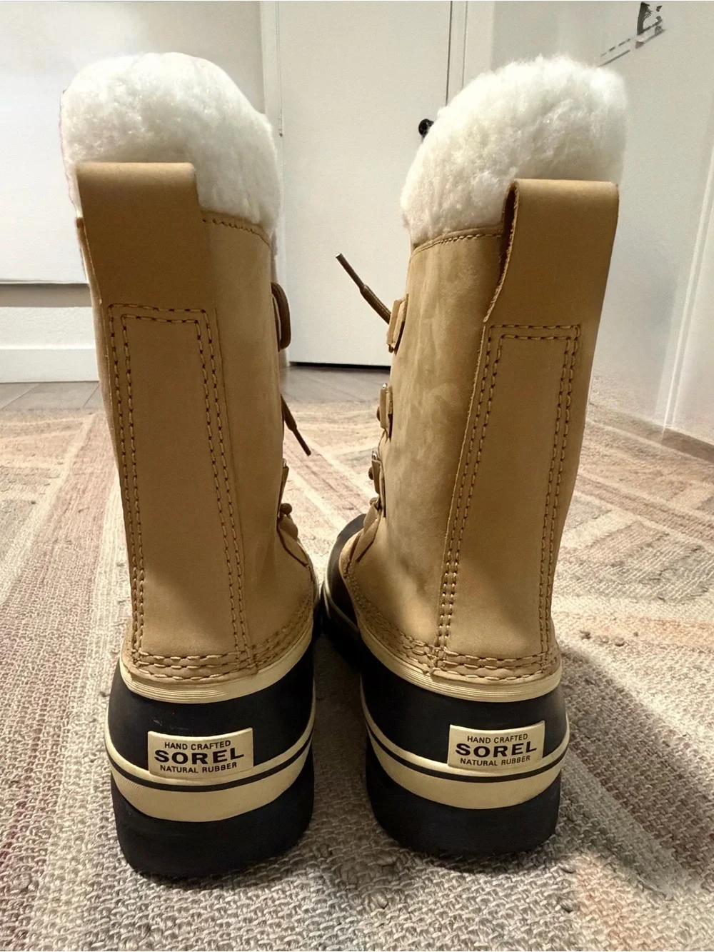 Sorel Tan and Black Caribou Lace-Up Winter Boots, women’s 9.5